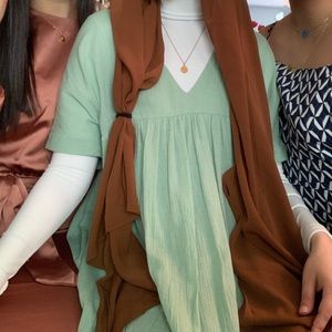 Turquoise dress, v neck, ends at the knees